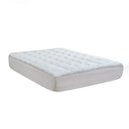 The cloud 9 Luxury High Loft Mattress Topper Displayed on a bed on a white background 