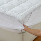 Up close of the Luxury High Loft Mattress Topper corner to show how it fits on the bed
