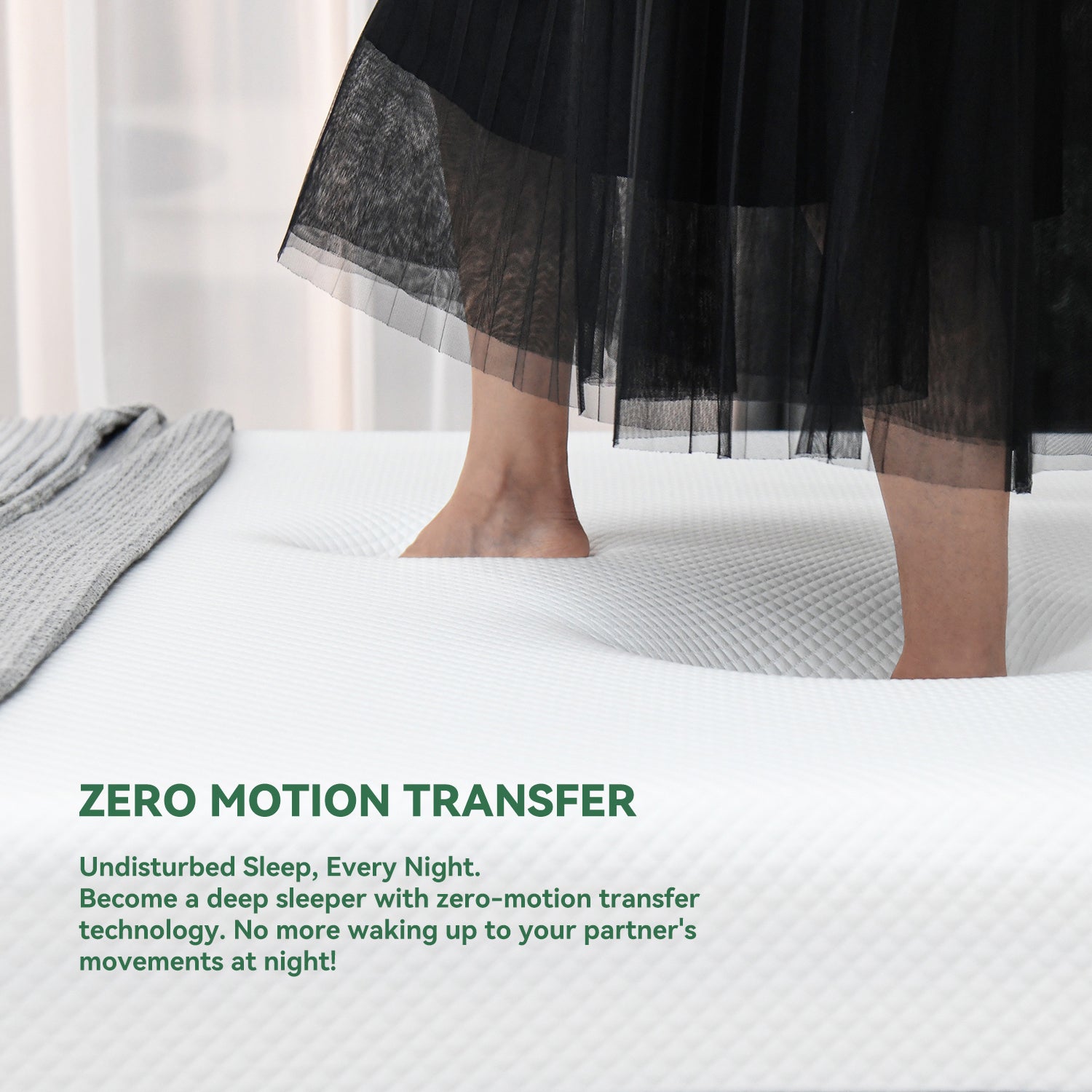 Person standing on the mattress surface to demonstrate zero motion transfer technology and pressure-absorbing comfort support.