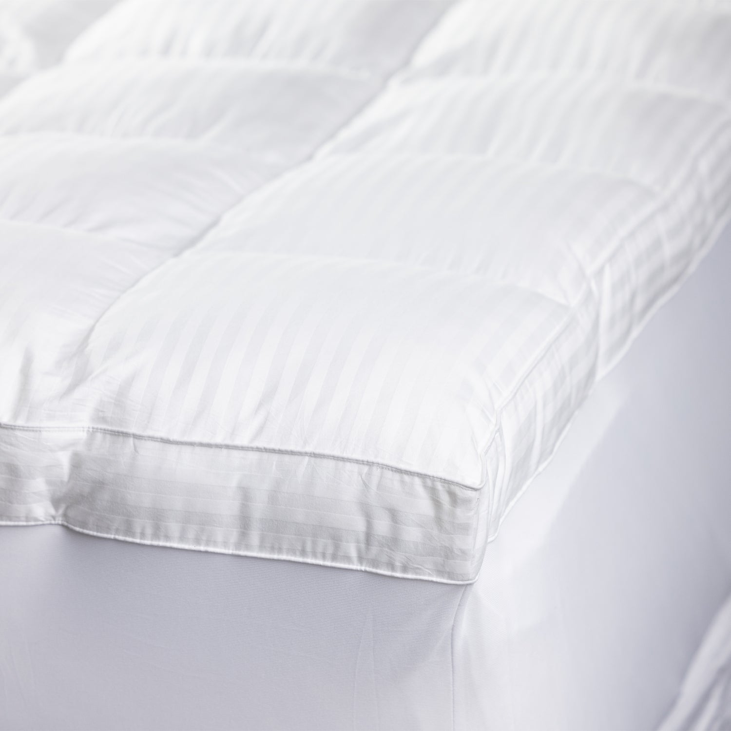 Design Republique Hotel Luxury Mattress Topper corner displayed out on a bed