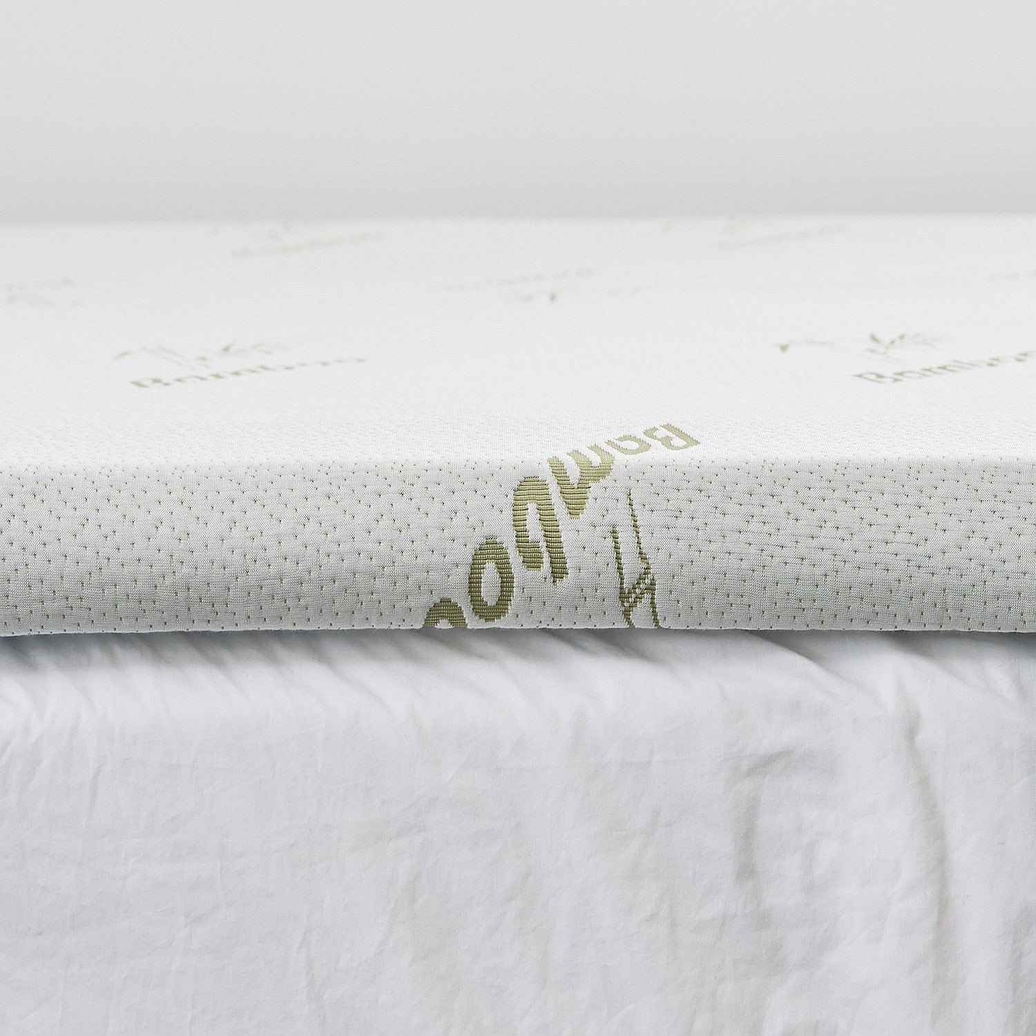 The bambou mattress topper on bed close up.