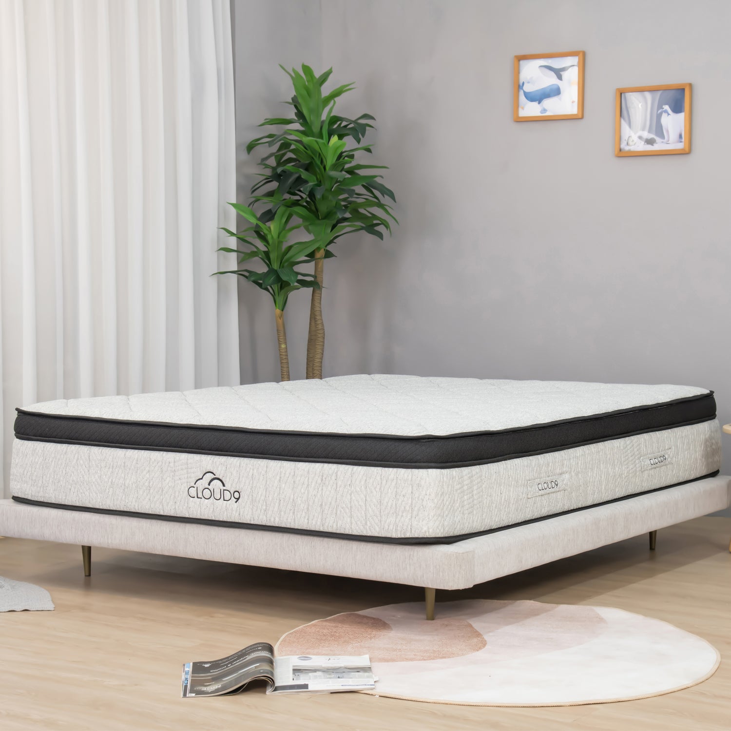 Close-up angled view of the Cloud 9 mattress featuring a plush quilted sleep surface and modern layered design in a contemporary bedroom setting.
