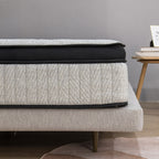 Close-up side profile of the Cloud 9 mattress showcasing its layered pillow-top design and textured fabric finish in a contemporary bedroom setting.
