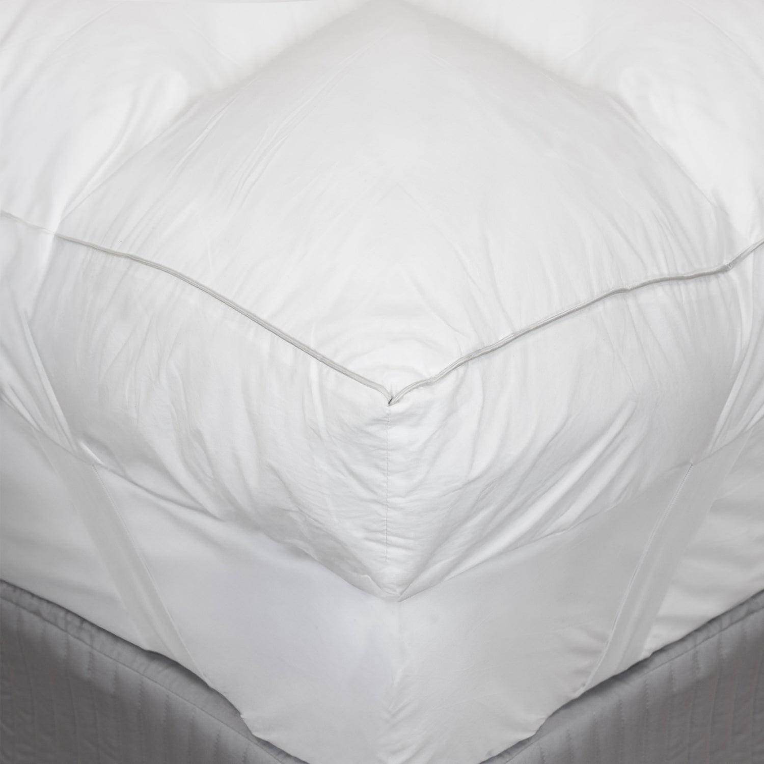 close up image of the corner of ardor mattress topper on a bed