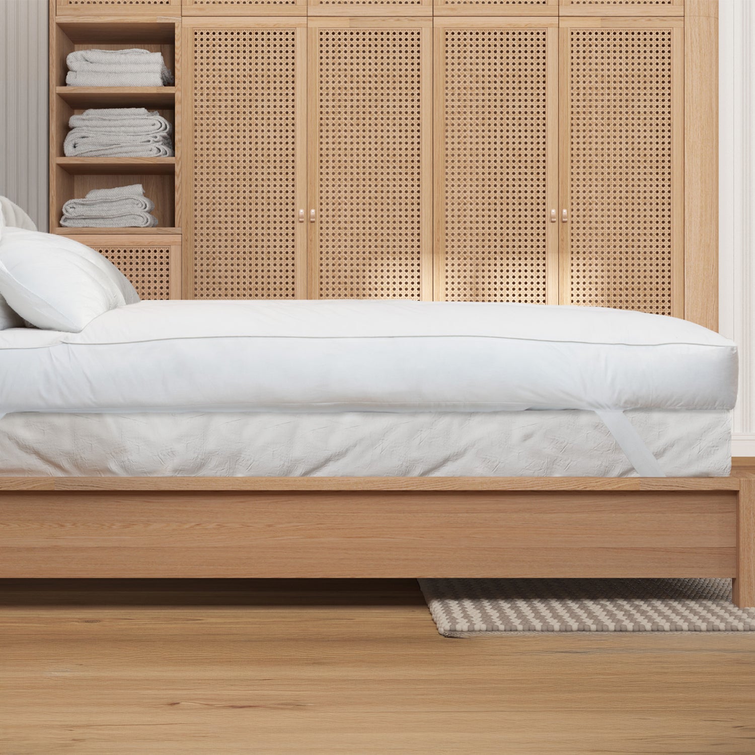 side image of the ardor mattress topper on a bed