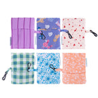 Set of six colorful fabric pouches with various patterns on a white background