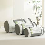 Bambou memory foam topper and pillow range packed in matching carry bags, displayed together on a tabletop to showcase the coordinated sleep collection.