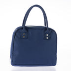 Navy lunch tote with zip closure, carry handles, and gold stud details on a white background.