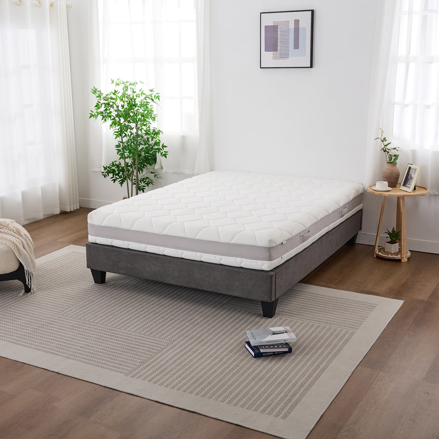 Cloud 9 Dual Side 7-Zone Mattress displayed on a grey bed base in a bright, modern bedroom.