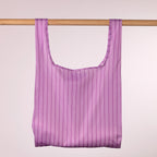 Home Co. Recycled Bottle Foldable Bag Stripe Lavender shown open and hanging on a wooden rail.