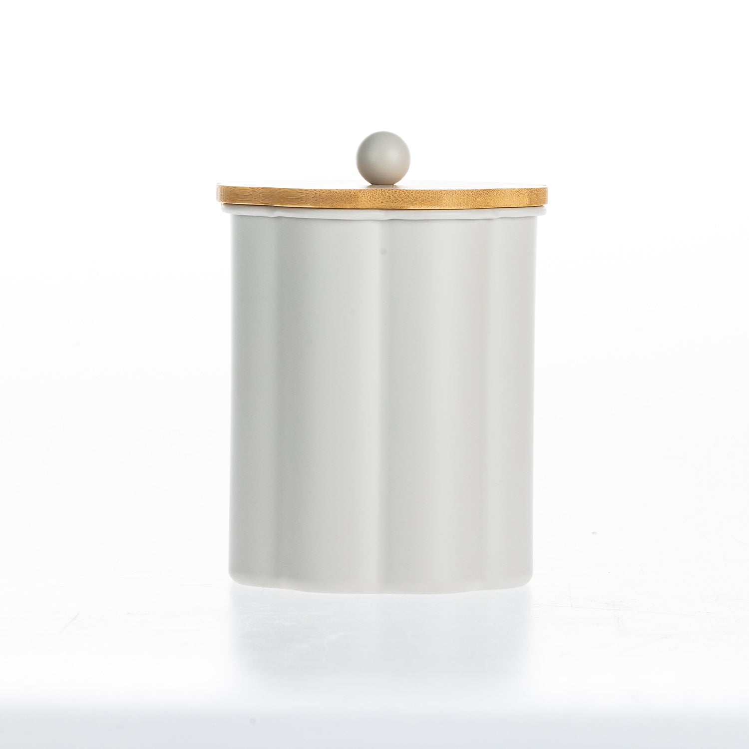 Gather Danni Canister in Latte  featuring a fluted cylindrical design with the bamboo lid removed, highlighting the spacious interior and natural wood lid with matching round knob.