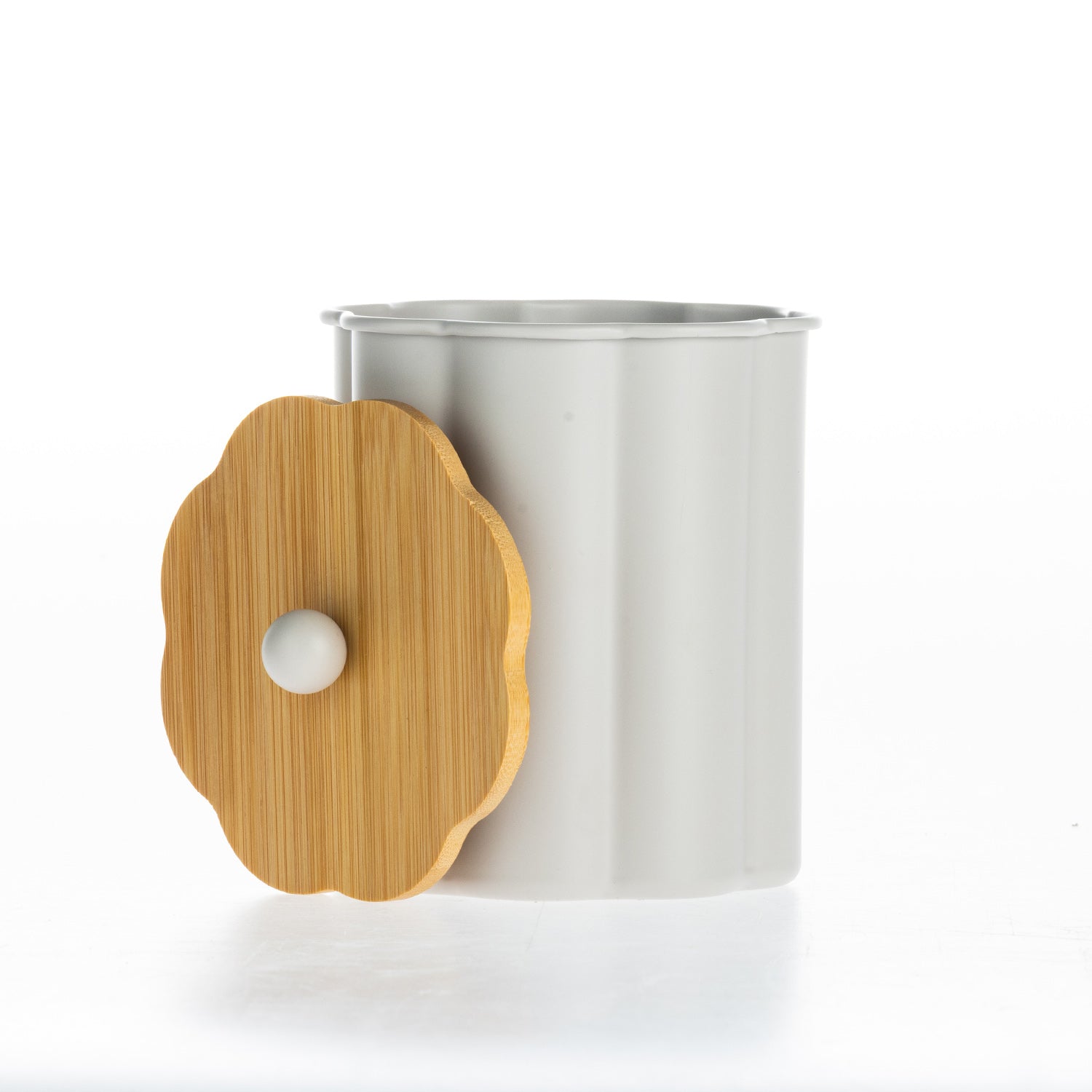 Gather Danni Canister in Latte featuring a fluted cylindrical design with the bamboo lid removed, highlighting the spacious interior and natural wood lid with matching round knob.