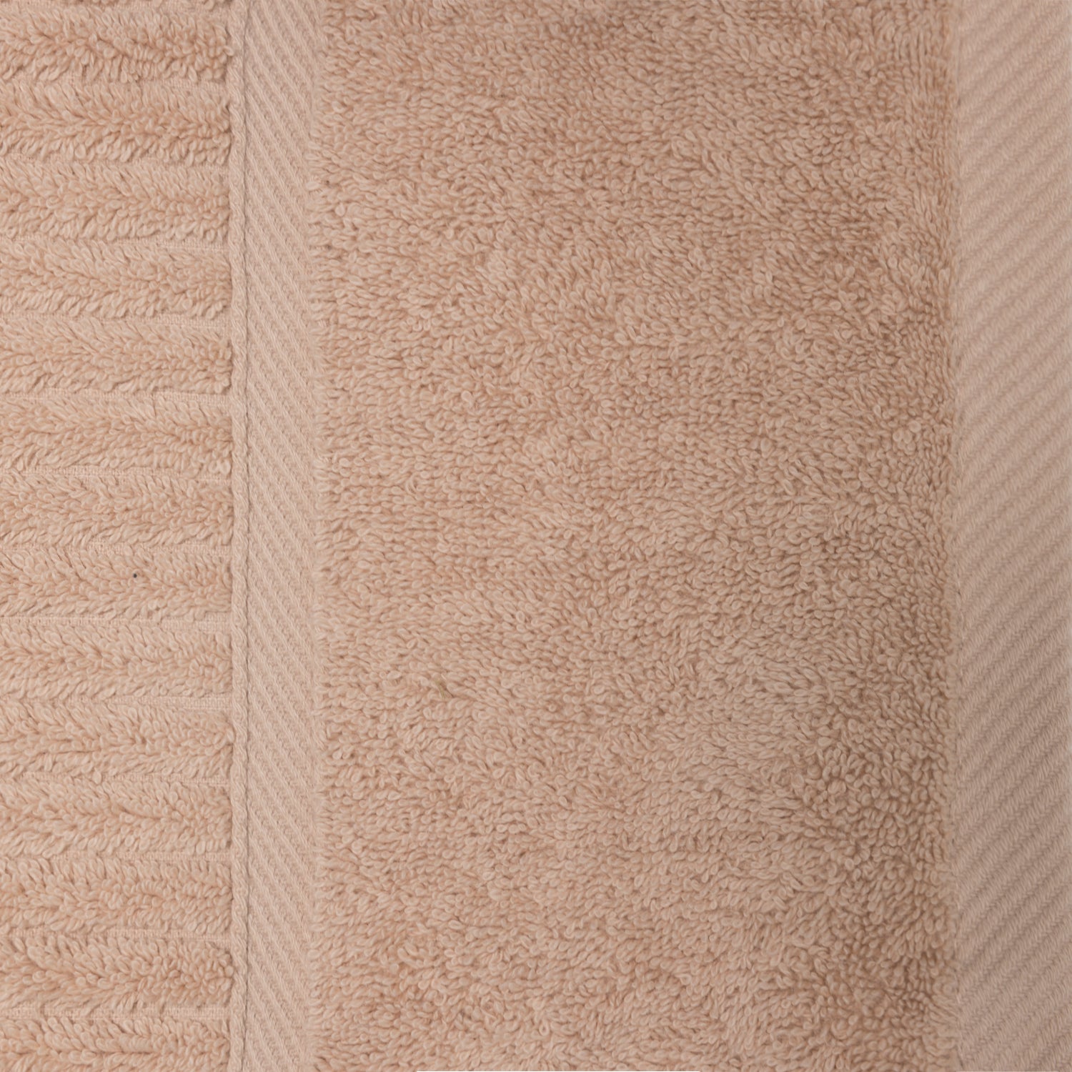 Close-up of the blush Design Plus Ivy towel showing the plush cotton texture, ribbed detailing and woven border.