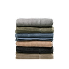 Design Plus Ivy towel range stacked in assorted colours, including silver, khaki, denim, blush, charcoal and taupe.