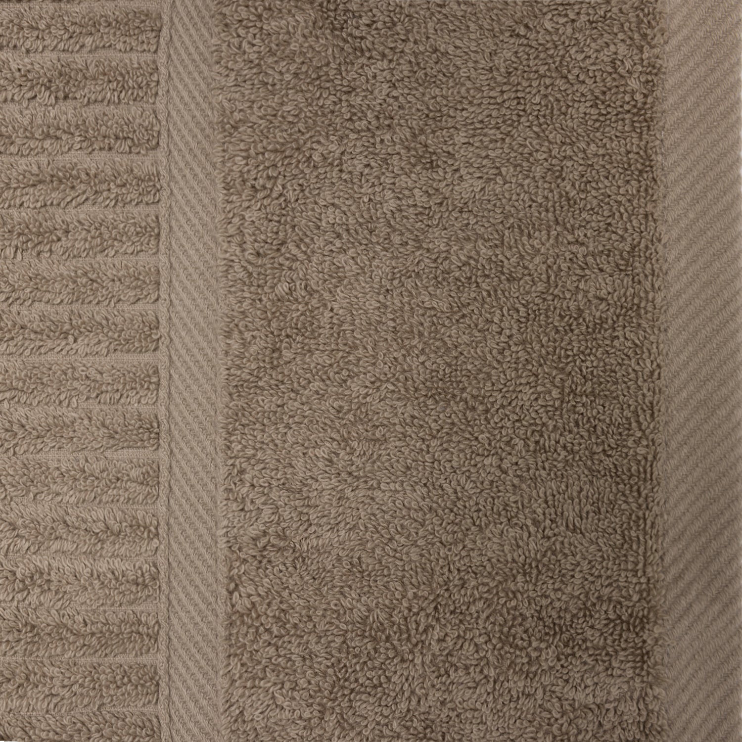 Close-up of the taupe Design Plus Ivy towel showing the plush cotton texture, ribbed detailing and woven border.