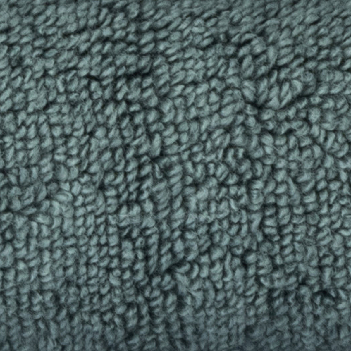 A close-up texture shot of a dark teal-gray bouclé or chenille fabric, showing the dense looped pile detail.