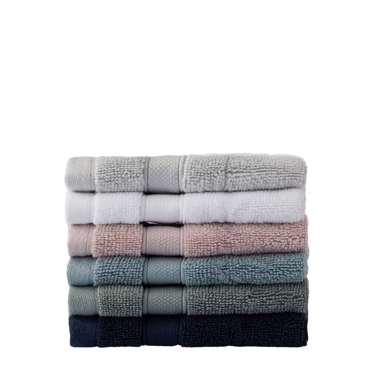 Stack of folded towels in various colors on a white background