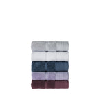 Stack of folded Design Republique Elani hand towels in Silver, White, Ocean, Lavender and Mulberry, displayed on a white background.
