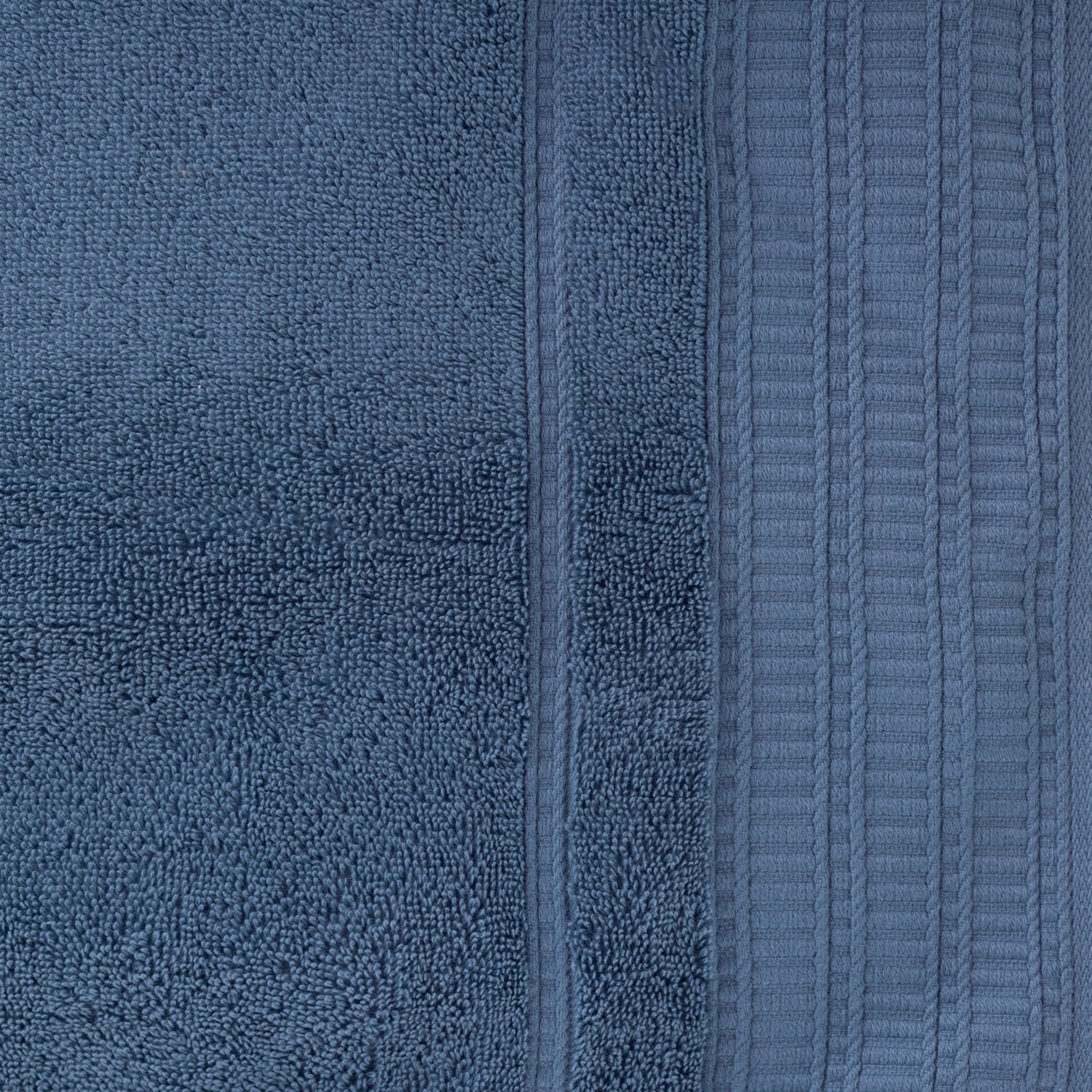Close-up of the Design Republique Elani Ocean hand towel, showing the soft terry texture and ribbed border detail.