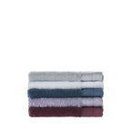 Stack of folded Design Republique Elani face cloths in Silver, White, Ocean, Lavender and Mulberry, displayed on a white background.
