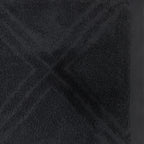 Close-up of the Design Republique Gemma Plush 550gsm bath sheet in charcoal, featuring a raised geometric terry pattern and smooth border.