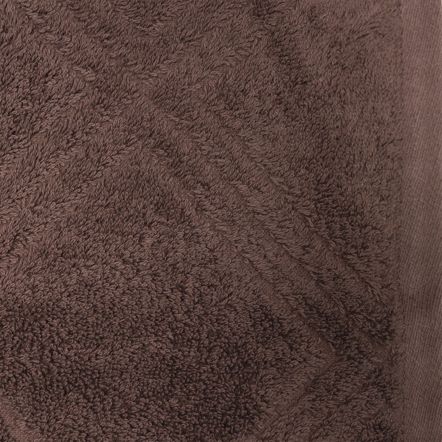 Close-up of the Design Republique Gemma Plush 550gsm bath sheet in coffee brown, showing its textured geometric design and woven edge.