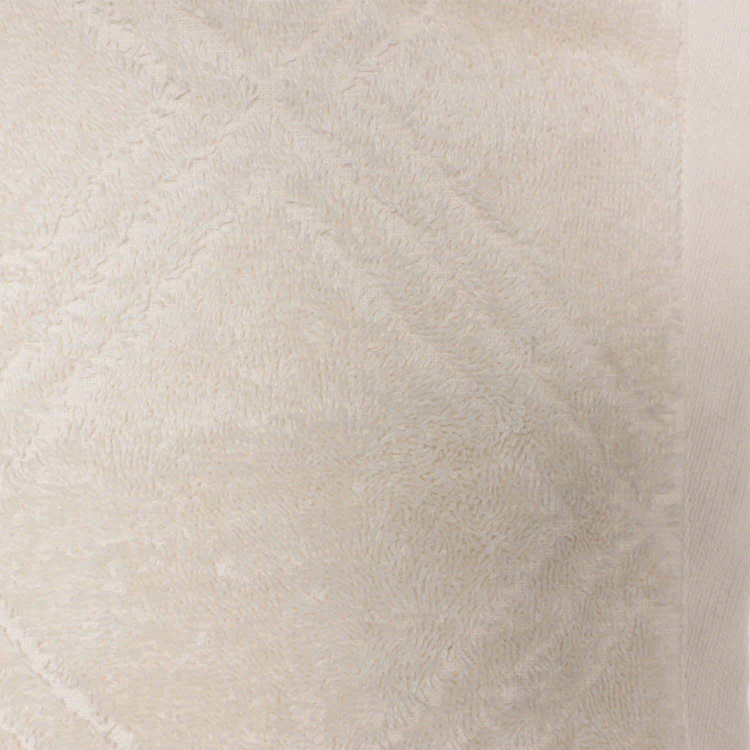 Close-up of the Design Republique Gemma Plush 550gsm hand towel in ivory, showing its soft terry texture and geometric detailing.