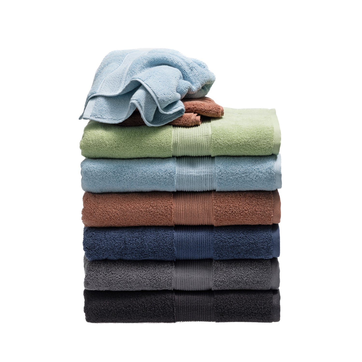 Stack of coordinating plush towels in multiple colours, with smaller towels layered over the folded bath towels.