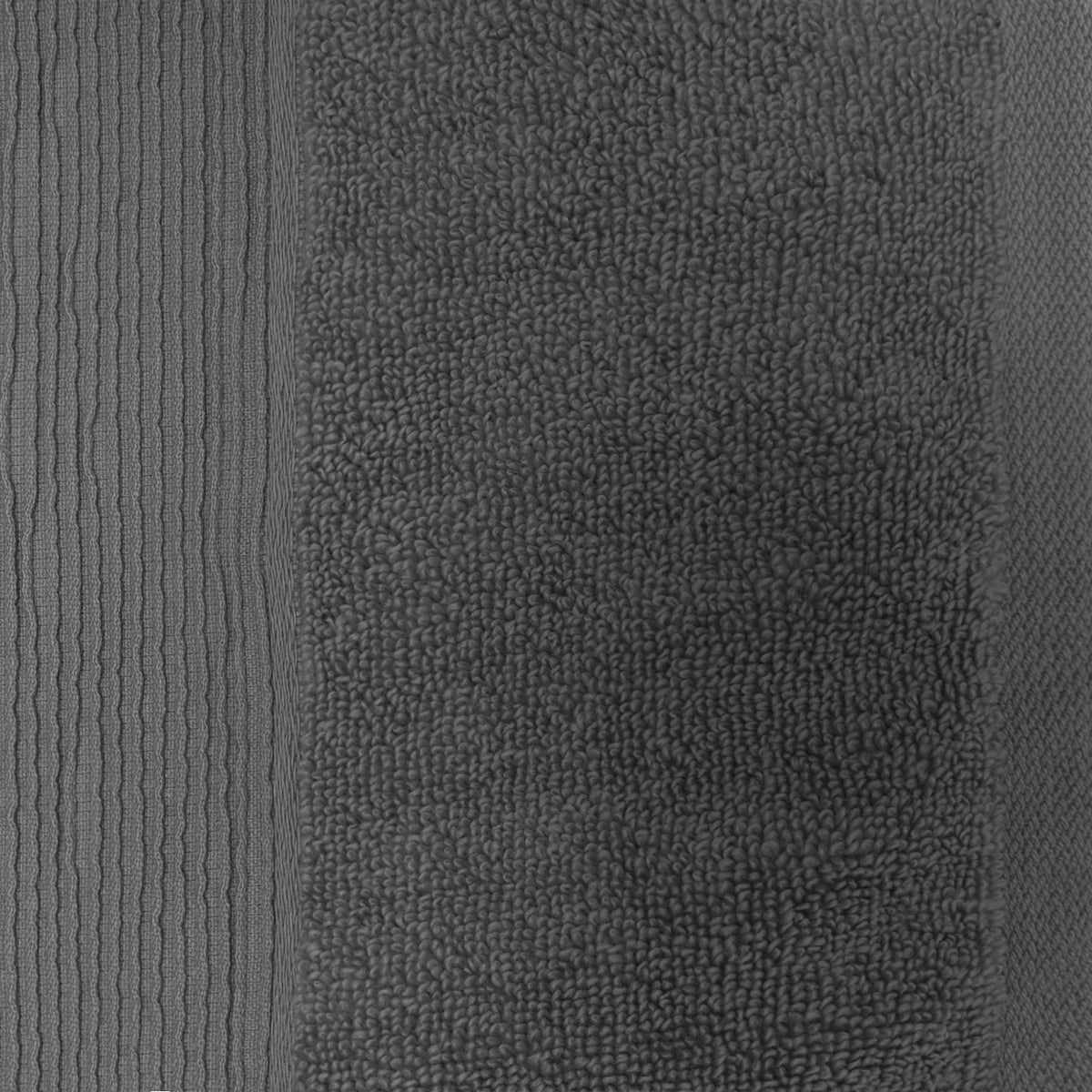Close-up of a smoke grey plush hand towel showing the soft looped cotton texture and ribbed border.