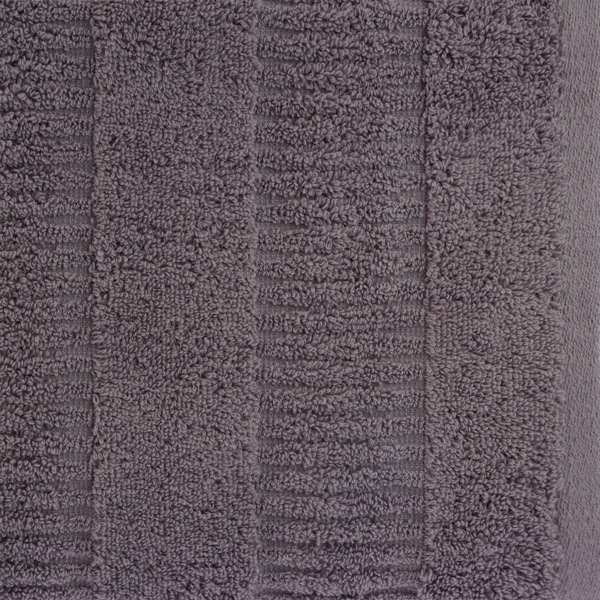Close-up of a grape Design Republique Addison textured bath towel showing the soft looped texture and raised stripe detailing.