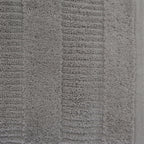 Close-up of a silver Design Republique Addison textured bath towel showing the soft looped cotton pile and raised stripe detailing.