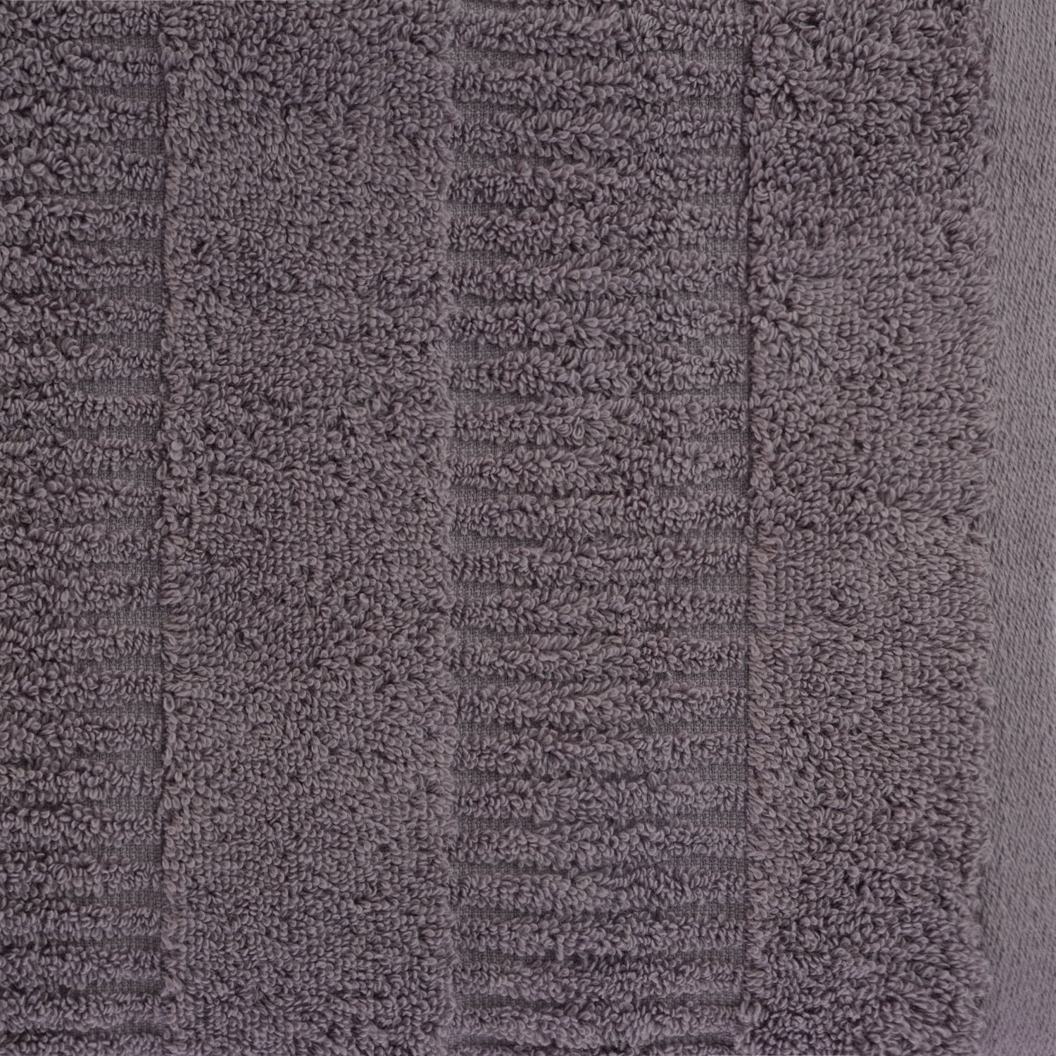 Close-up of a grape Design Republique Addison textured hand towel showing the soft looped texture and raised stripe detailing.