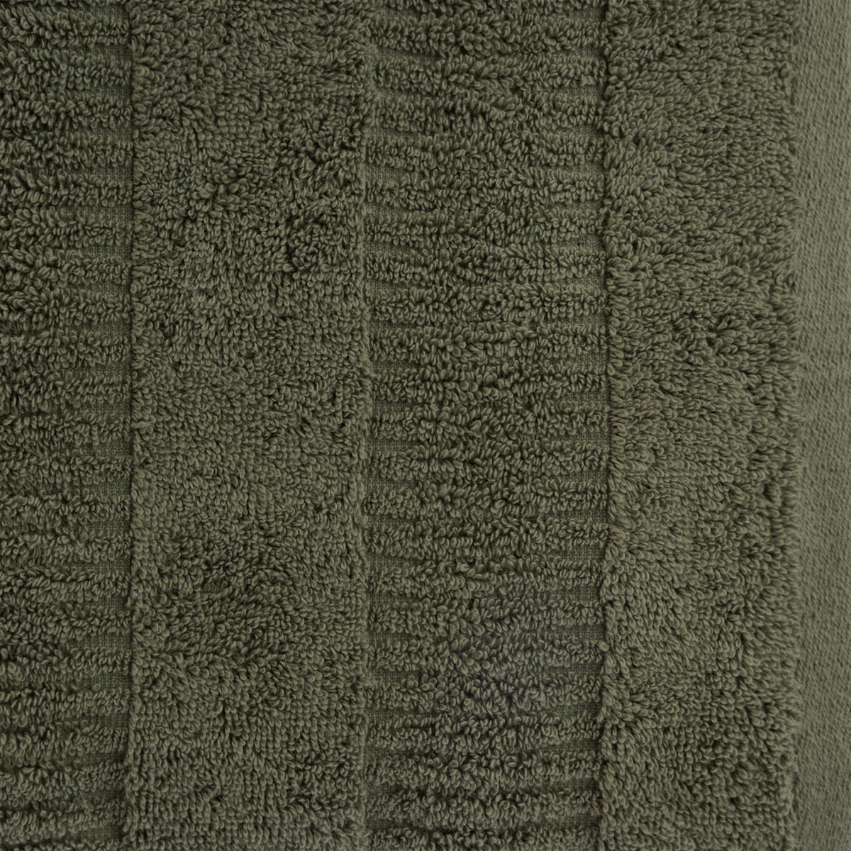 Close-up of a khaki Design Republique Addison textured hand towel showing the plush cotton texture and contemporary stripe design.
