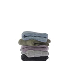Stack of five folded Design Republique Addison textured hand towels in faded blue, khaki, grape, silver and charcoal, featuring a soft textured stripe pattern.