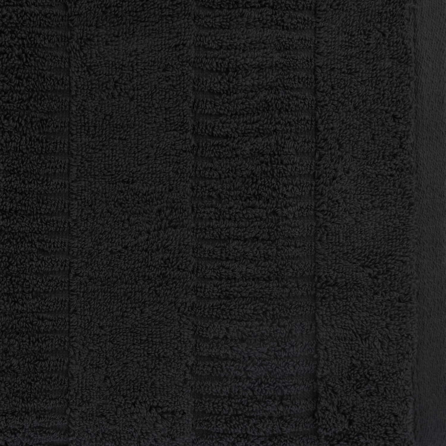Close-up of a charcoal Design Republique Addison textured face cloth showing the soft looped cotton texture and raised stripe detailing.