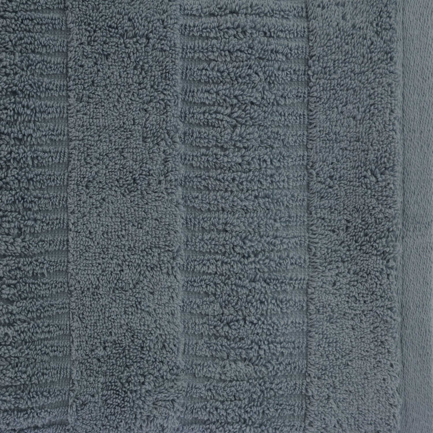 Close-up of a faded blue Design Republique Addison textured face cloth showing the plush cotton pile and textured stripe pattern.