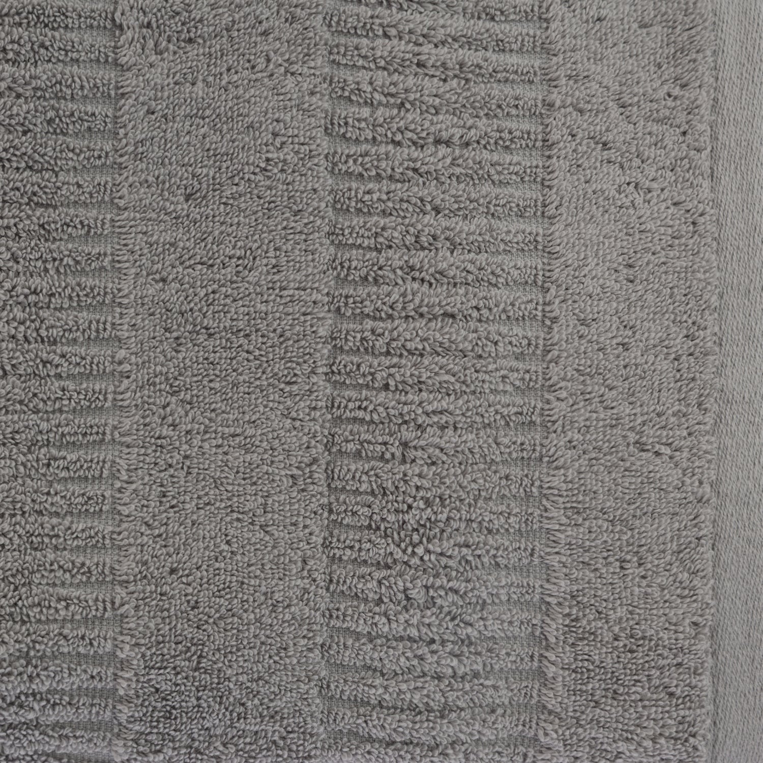 Close-up of a silver Design Republique Addison textured face cloth showing the soft looped cotton pile and raised stripe detailing.