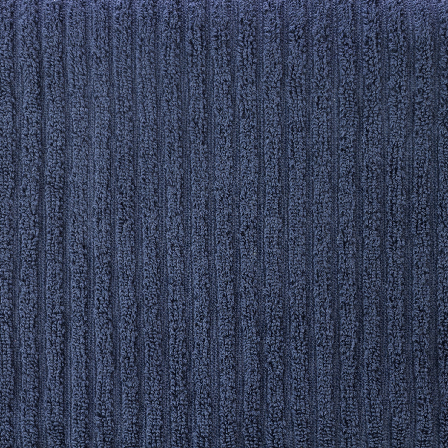 Close-up of a blue Home Co. Lara Stripe bath sheet showing the soft looped cotton texture and subtle ribbed stripe design.