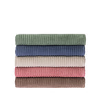 Stack of five folded Home Co. Lara Stripe bath sheets in green, blue, sand, blush and mocha.