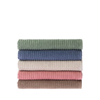 Stack of five folded Home Co. Lara Stripe bath towels in green, blue, sand, blush and mocha.