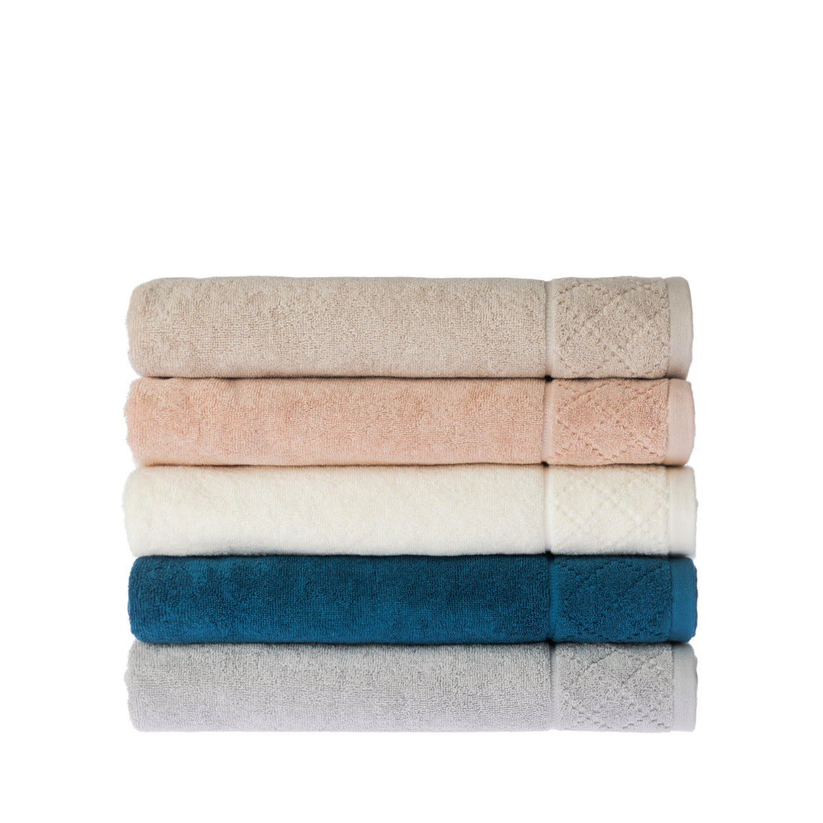 Neatly folded stack of Gracious Living Marilyn bath sheets in beige, peach, white, teal and silver, showing the subtle textured pattern and decorative border detailing.