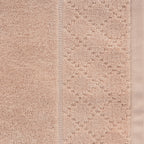 Close-up of the Gracious Living Marilyn Bath Sheet in rose, showing the soft cotton loop texture and decorative woven border.