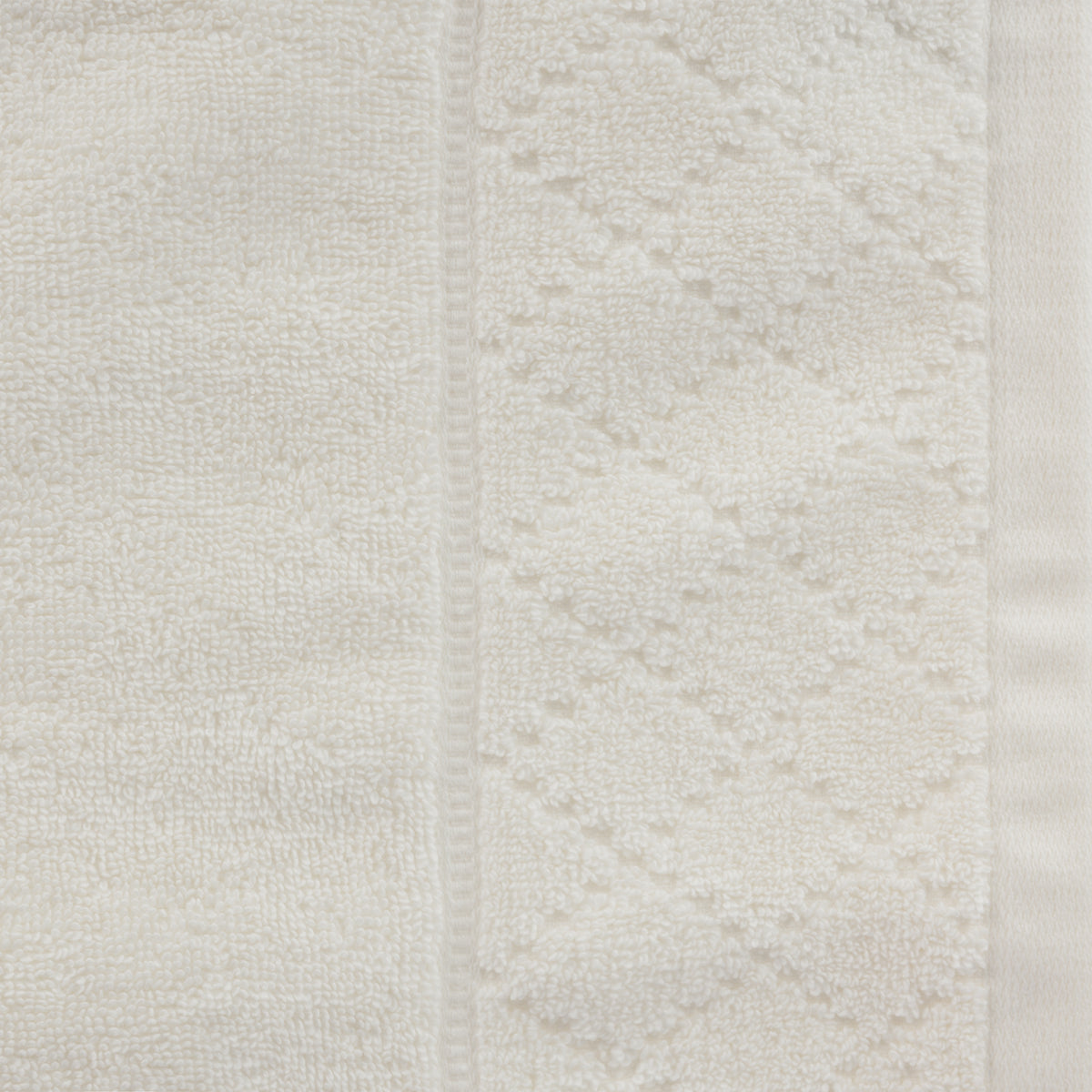 Close-up of the Gracious Living Marilyn Bath Sheet in white, showing the soft cotton loop texture and subtle decorative border.