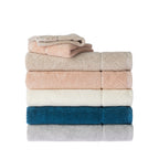 Stack of Gracious Living Marilyn towels in neutral, peach, white, teal and silver colours, featuring soft cotton texture and decorative woven borders, with smaller towels layered on top.