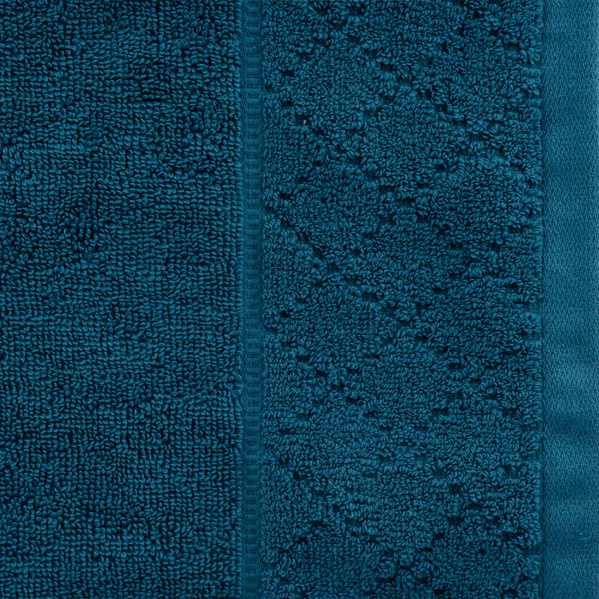 Close-up of the Gracious Living Marilyn Face Cloth in teal, highlighting the rich teal colour, soft texture and patterned border.