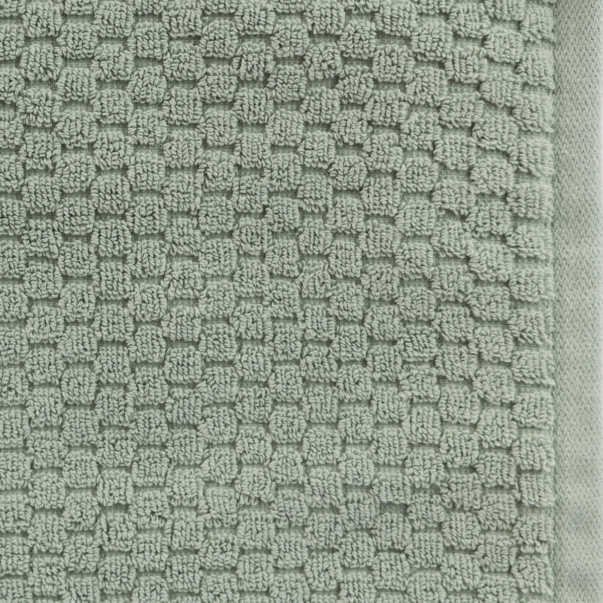 Close-up of the Design Republique Quinny Popcorn Bath Sheet in Sea Mist, showing the raised popcorn-style loop texture and woven border.