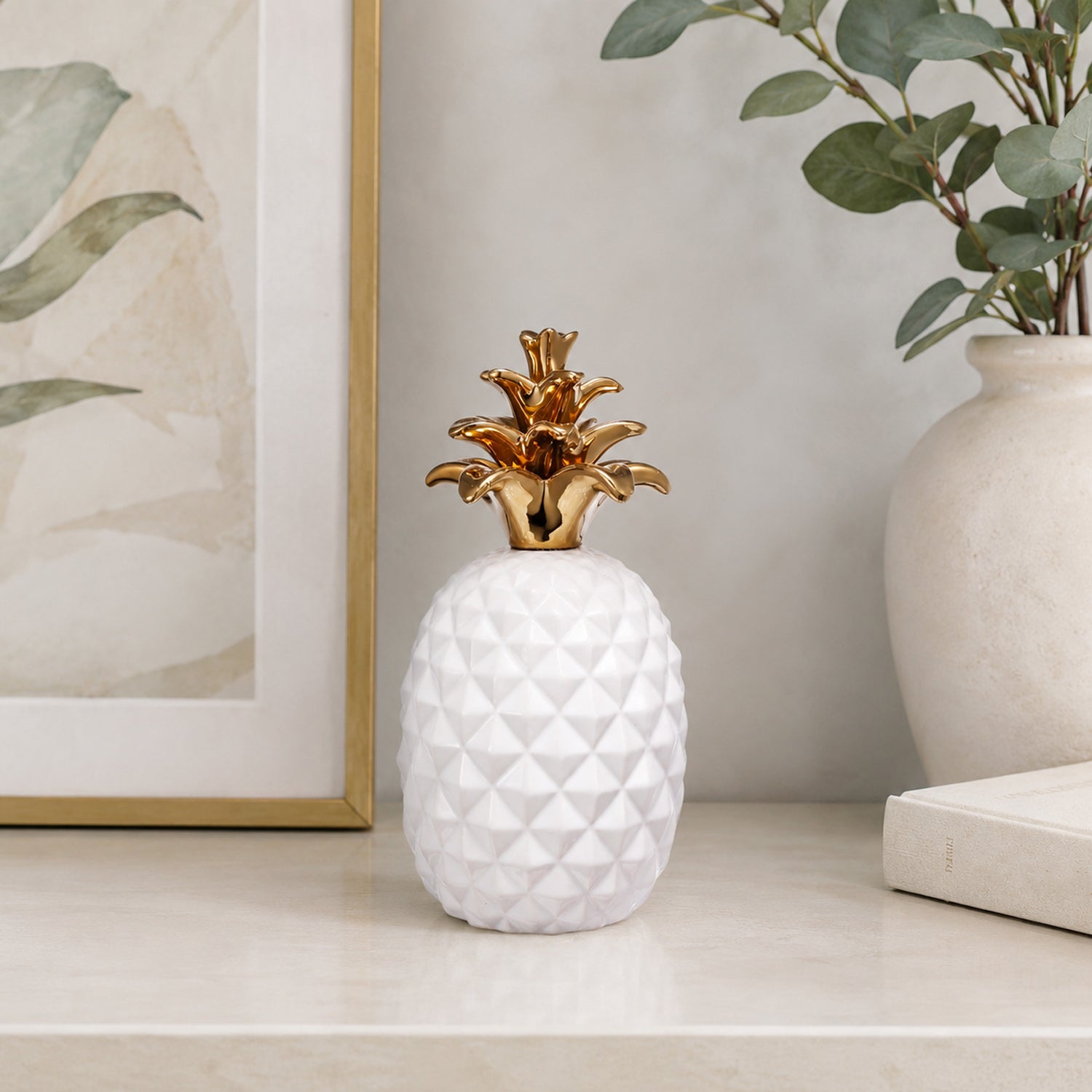 Design Republique Pippa Pineapple Décor Piece in white, styled on a tabletop with a gold pineapple top and textured body.