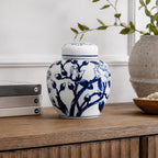 Gracious Living Magnolia Jar in blue and white, styled on a wooden console with a classic floral design and lidded top.