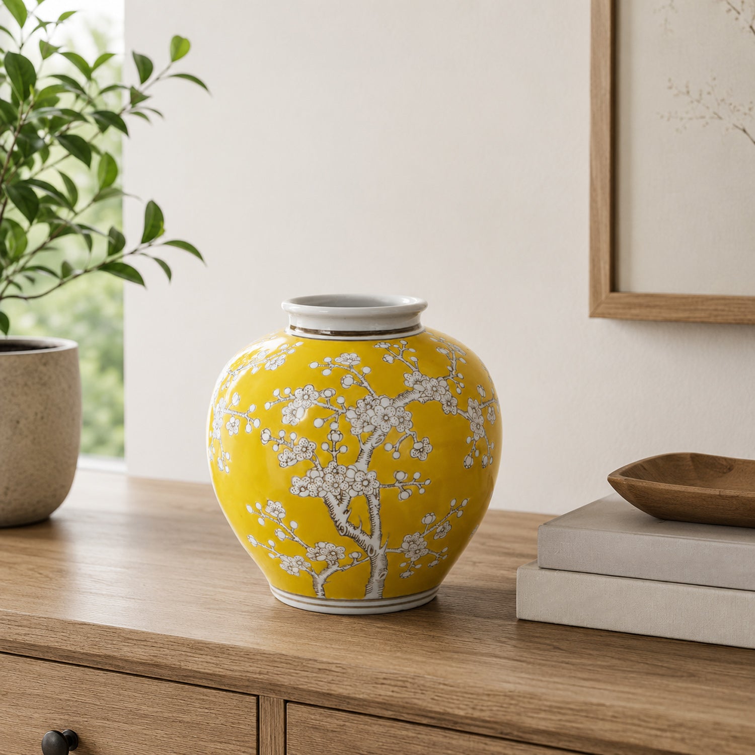 Gracious Living Yellow Plum Blossom Bowl Vase styled on a wooden sideboard.