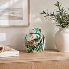 Design Republique Jungle Lidded Jar Multi Coloured styled on a wooden sideboard.